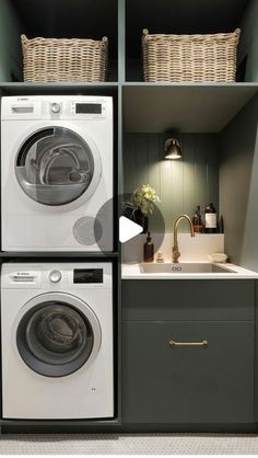 two washers and a dryer in a small room