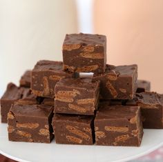 a white plate topped with brownies on top of a table