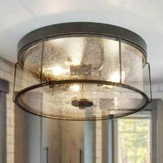 a light fixture hanging from the ceiling in a room