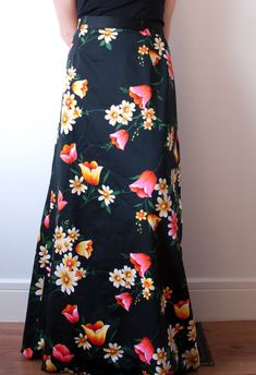 Black floral maxi skirt by Casualaire London Design Zips up the back and has a button closure Covered in a stunning vibrant floral pattern  Measurements: Fits - medium to large Waist - 30" Hip - 47" Length - 41.5" Condition - Excellent - No major visible flaws Label- Casualaire London Design  *All measurements are taken in inches. Please compare and ensure fit of item before purchase. Please feel free to contact me with any questions. Looking for more skirts? Check out these listings: https://ww Black Floral Print Maxi Skirt For Spring, Black Floral Print Maxi Skirt For Beach, Summer Black Maxi Skirt With Floral Print, Beach Black Floral Print Maxi Skirt, Vintage Floral Print Long Maxi Skirt, Vintage Floral Print Maxi Skirt, Formal Maxi Skirt, Black Floral Maxi Skirt, Skirt With Zipper