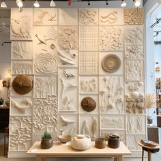 the wall is made up of many different types of clay and other things on display