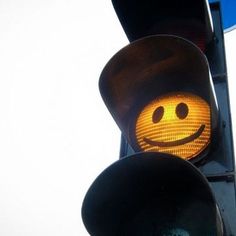 a traffic light with a smiley face on it