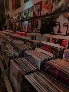 there are many records on the shelves in this room, and one is full of them