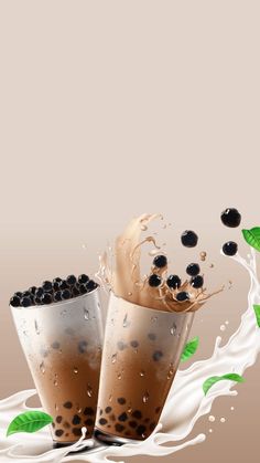 two cups filled with milk and black olives are splashing out of the cup