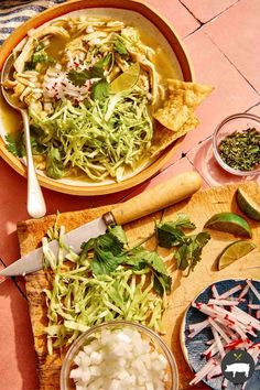 two bowls filled with food sitting on top of a table