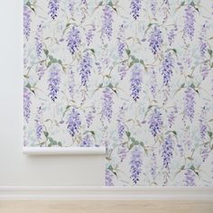 the wall paper has purple flowers on it