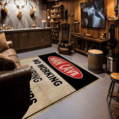 a living room filled with lots of furniture and deer heads on the wall behind it