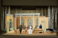 a scene from the stage shows a man and woman standing in front of a piano