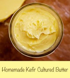 homemade kefir cultured butter in a glass jar on a wooden table with the words, homemade kefir cultured butter