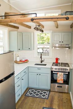 a kitchen with an oven, stove and refrigerator