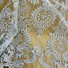 This exquisite Corded Bridal Lace Fabric Embroidered on 100% Polyester Net Mesh from Lace USA is the perfect fabric for all of your special occasions. Whether you are looking for something for your wedding dress, evening gown, dance costume or quinceanera dress lace, this corded couture lace is the perfect fabric to make you stand out. Its combination of beauty and quality make it the perfect choice for all of your special occasions. This corded embroidered lace fabric is handmade with the highest quality craftsmanship, and is available in 5 different colors. Its floral design is elegant, and perfect for all of your decorative purposes. With its special occasion lace you can make any dress unique, turning your outfit into a work of art. This corded elegant lace is lightweight, yet sturdy a Quinceanera Crown, Wedding Dress Evening, Corded Lace Fabric, Bridal Lace Fabric, Holiday Hours, Embroidered Lace Fabric, Quinceanera Dress, Corded Lace, Bridal Tiara