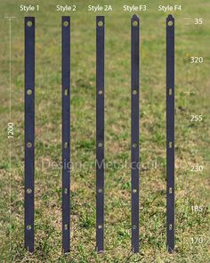 four metal poles are in the grass with numbers on each pole and measurements for them