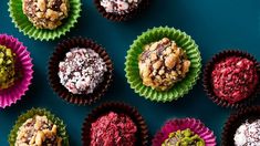 there are many different desserts in the cupcake liners on the table together