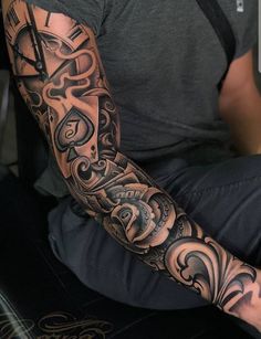 a man with a tattoo on his arm