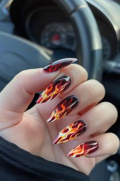 Ignite your style with 30 flame nail designs! From bold and fiery to subtle and chic, discover the perfect look to heat up your manicure and make a statement Fire Themed Nails, Red Nails Flame Design, Almond Nails Designs Flame, Nails With Flame Design, Colorful Flame Nails, Flame Art On Nails, Purple Flame Nail Art, Fire Nails Designs, Flame Nail Designs