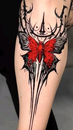 a woman's thigh with tattoos on it and a red butterfly in the middle