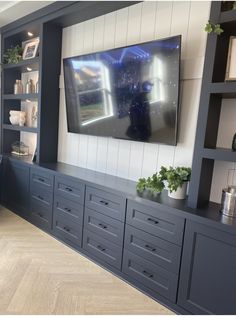 a large flat screen tv mounted to the side of a wall