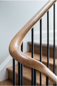 a wooden hand rail on a stair case