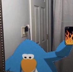 an image of a blue bird in front of a mirror with the phone on it's side