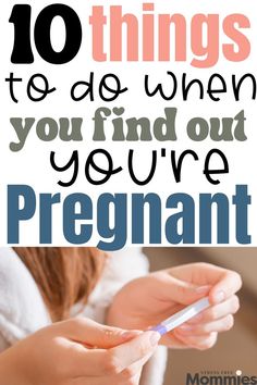 a person holding a cell phone with the text 10 things to do when you find out your pregnant