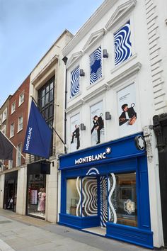 the storefront of montblanc is painted blue and white