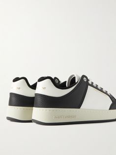 SAINT LAURENT's 'SL/61' style is a great way to up your sneaker game, while maintaining a classic look. They have panelled leather uppers with perforated toe boxes and are stamped with gold lettering across the back and sides. Saint Laurent Collection, Saint Laurent Sneakers, Leather Sneakers Men, Gold Lettering, Sneakers For Men, Sneaker Games, Perforated Leather, Gold Letters, Black Sneakers