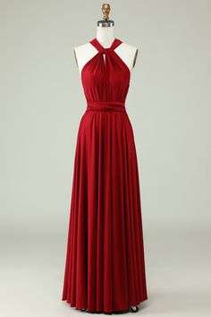 a red dress on a mannequin with a halter top and pleated skirt