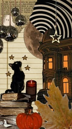 a black cat sitting on top of a pile of books next to a lit candle