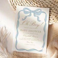 a baby shower card with a bow on it