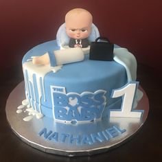 a baby is sitting on top of a cake