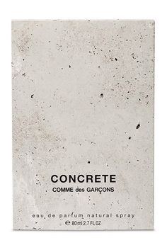 the back side of a white box with black speckles on it that says congrete comme des garcons