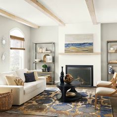 a living room filled with furniture and a fire place in the middle of a room