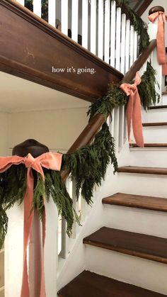 the stairs are decorated with garland and bows