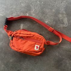 New Without Tags, Color Name Is "Rowan Red" However The Color Is More Orange In Person. Please See Photos Light Hip Pack Made From Recycled Nylon, Perfect For Daytrips And Travelling. Produced Without Pfcs, Made For A Lifetime Of Use. Fjallraven Belt Bag, Fjallraven Sling, Red Pouch Belt Bag For Travel, Fjallraven Hip Pack, Kanken Backpack Orange, Fjallraven High Coast, Pack Bag, Hip Pack, Travel Pack