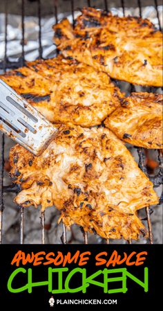 someone is grilling some chicken on the grill with a spatula in their hand