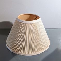 a lamp shade sitting on top of a table