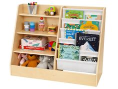 a wooden book shelf filled with lots of books and toys on top of white background