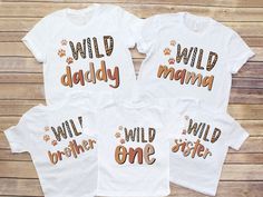 three white shirts with the words wild daddy, i will be one and an orange paw print