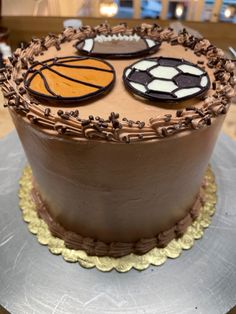 a chocolate cake with frosting and decorations on it