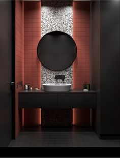 a bathroom with a sink, mirror and tiled wall in it's center area