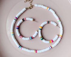 "more cute and fun necklaces and earrings in DearDanielleJewelry: https://www.etsy.com/shop/DearDanielleJewelry?ref=seller-platform-mcnav§ion_id=28417638 surfer heishi choker necklace. rainbow heishi beads necklace(necklace only). rubber beads necklace. cute surfer necklace. please choose your color: white, rainbow, pink, turquoise, black adjustable necklace length: 15-17\" Bead size: 1/4\" diameter **framed gems and charms are gold plated which means you can have beautiful and trendy jewelries Rubber Beads Necklace, Heishi Beads Necklace, Heishi Jewelry, Beads Choker Necklace, Heishi Bracelets, Rubber Bead, Surf Necklace, Fimo Beads, Homemade Bracelets