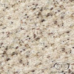 a close up view of the surface of a granite countertop with brown and white speckles