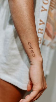 75 Unique Small Tattoo Designs & Ideas : Hearts Drawn Hearts On Arm Tattoo, Tattoos Two People, Tattoo Ideas Female 2023, Women Tatoos Ideas With Meaning, Small Tattoos For Girls Unique, Tattoo For Boyfriend Ideas, With All My Heart Tattoo, Line Of Hearts Tattoo, Family Drawn Heart Tattoo