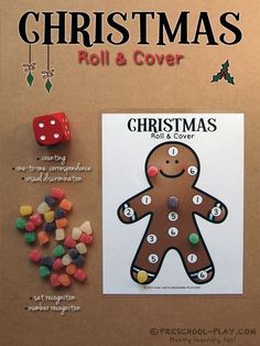 the christmas roll and cover is next to some candy candies, dices and a gingerbread man