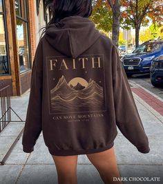 Faith Can Move Mountains Matthew 17:20 bible verse Christian hoodie tee. * K E E P * S H O P P I N G *   ✺ Check out this design on a T-Shirt here: https://www.etsy.com/ie/listing/1728558307/faith-can-move-mountains-christian-shirt? ✺ Check out this design on a Hoodie here:  https://www.etsy.com/ie/listing/1704614617/christian-hoodies-jesus-hoodie-christian? ✺ Shop our entire Quite Nice Studios collection here:  https://www.etsy.com/shop/QuiteNiceStudio * Q U I C K * F A C T S * ✺ 50% Cotton 50% Polyester ✺ Wash (inside out) and dry normally (on cool for best results) * S I Z I N G * ✺ Sizing is unisex so runs like men's, though not overly large ✺ Most women find their typical size works best, since they are meant to fit a touch loose ✺ For an oversized look size up 1-2+ sizes! ✺ Size guid Hoodies Aesthetic Christian, Brown Hoodie Design, Jesus Hoodies Aesthetic, Christian Merch Aesthetic, God Hoodies, Christian Clothes, Matthew 17, Christian Merch, Faith Can Move Mountains