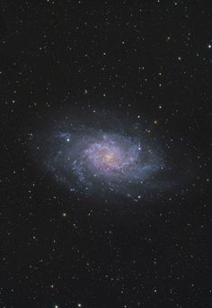 an image of a spiral galaxy in the sky