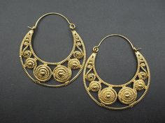 Premium gold plated brass earrings with unique and intriguing design patterns. RETURNS: Our major goal is to present all products as promised with accurate item descriptions along with pictures. But there are times when you may need to return occasionally. Returns are happily accepted but then we kindly request you to complete all your return within 30 days of receiving your item/s. **All the item/s must be returned unused and without any damage in the same condition you received it, with proper Unique Gold Jewelry Designs, Hippie Earrings, Gold Jewellery Design, Earrings Boho, Girls Earrings, Design Patterns, Brass Earrings, Gold Plated Earrings, Earrings Dangle