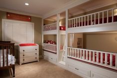 a bedroom with bunk beds, dressers and a baby crib in the corner