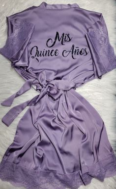 a purple robe with the words, miss quince - aniex on it