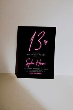 a black and pink birthday party card with the number sixteen on it's front